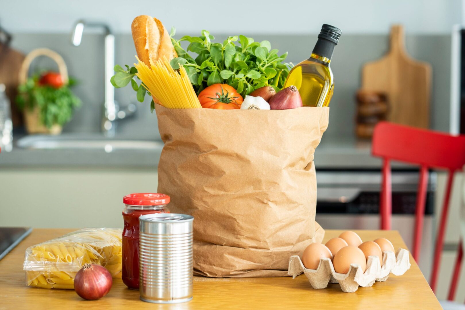 Kitchen table with groceries and eggs